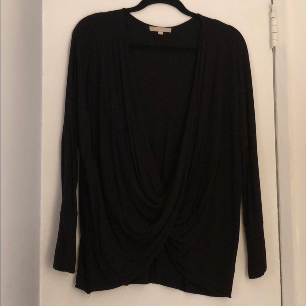 Black draped top. Wear with black cami.